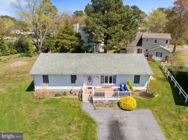 605 Old Post Ct, Bethany Beach, DE 19930 - view of front facade featuring a wooden deck and a front yard