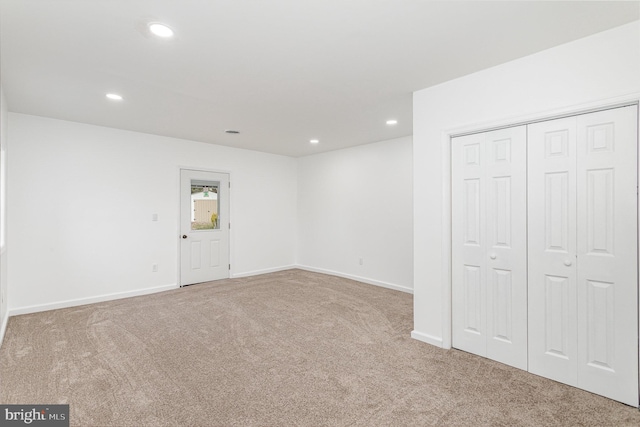 interior space featuring carpet flooring, baseboards, and recessed lighting