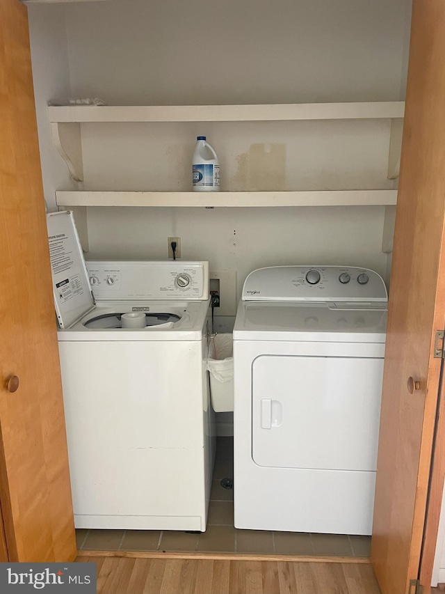 laundry area with separate washer and dryer and laundry area