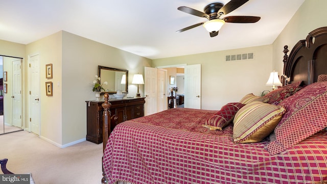bedroom with baseboards, visible vents, ceiling fan, and carpet flooring