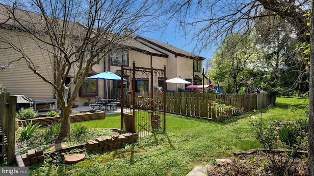 view of yard with a patio and fence