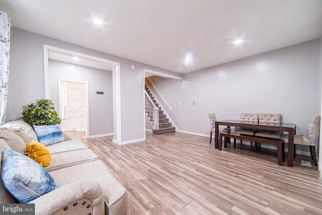 417 E Main St, Millville, NJ 08332 - living room featuring stairs, light wood finished floors, and baseboards