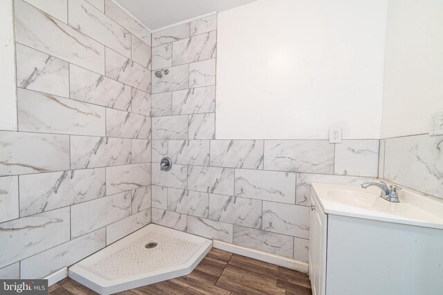 417 E Main St, Millville, NJ 08332 - full bathroom featuring a shower stall, vanity, and wood finished floors
