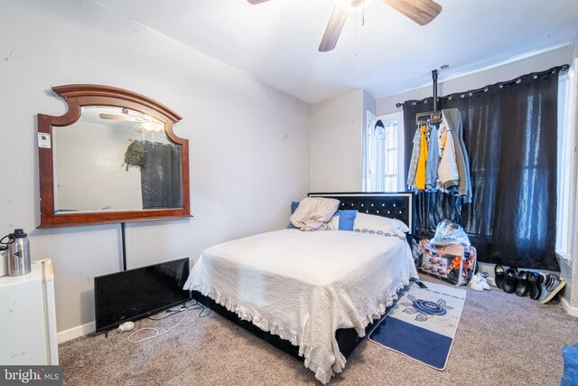 417 E Main St, Millville, NJ 08332 - bedroom featuring baseboards, a ceiling fan, and carpet