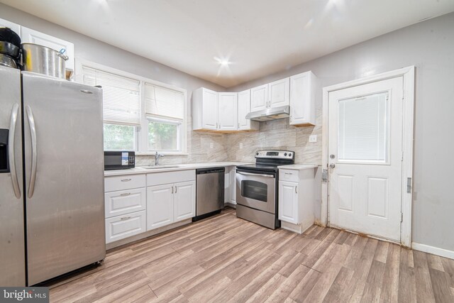 417 E Main St, Millville, NJ 08332 - kitchen with light wood-style floors, appliances with stainless steel finishes, a sink, and under cabinet range hood