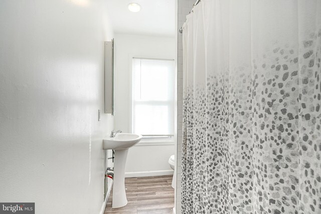 417 E Main St, Millville, NJ 08332 - bathroom featuring toilet, curtained shower, wood finished floors, and baseboards