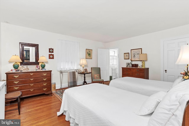 bedroom with wood finished floors