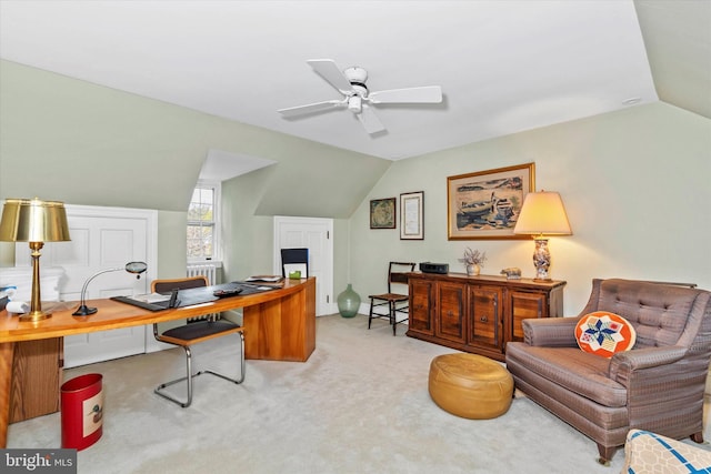 office space featuring carpet floors, a ceiling fan, and lofted ceiling