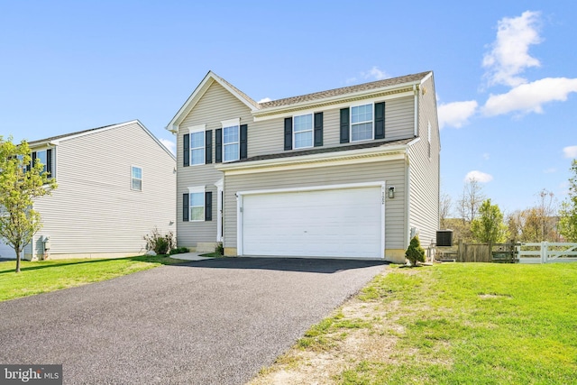 122 Abbigail Xing, Townsend, DE 19734 - traditional-style house featuring a front lawn, central air condition unit, driveway, fence, and a garage