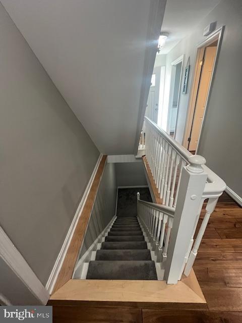 474 Colonial Ridge Ln, Arnold, MD 21012 - stairs featuring hardwood / wood-style flooring and baseboards
