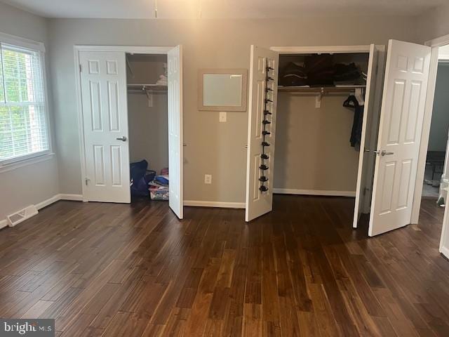 474 Colonial Ridge Ln, Arnold, MD 21012 - unfurnished bedroom with multiple closets, wood finished floors, and baseboards