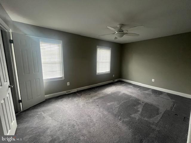 474 Colonial Ridge Ln, Arnold, MD 21012 - empty room with ceiling fan, dark colored carpet, and baseboards