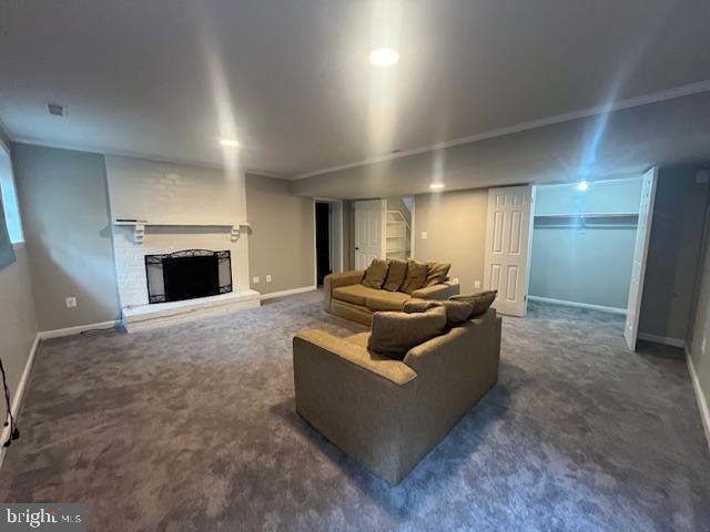 474 Colonial Ridge Ln, Arnold, MD 21012 - carpeted living room featuring a fireplace with raised hearth and baseboards