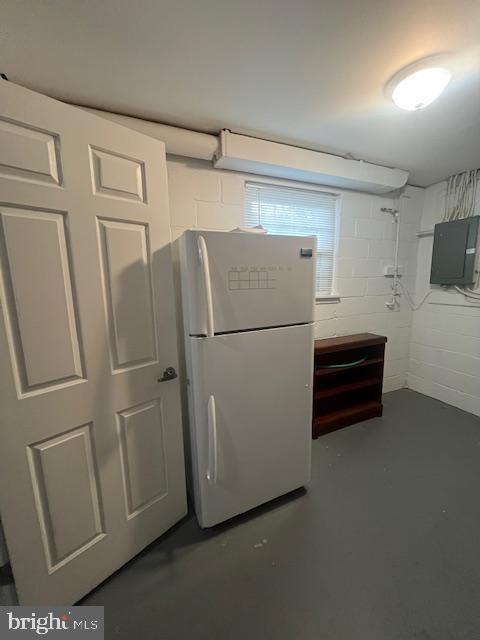 474 Colonial Ridge Ln, Arnold, MD 21012 - basement with freestanding refrigerator, electric panel, and concrete block wall