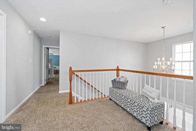 corridor with baseboards, an upstairs landing, a chandelier, recessed lighting, and carpet flooring