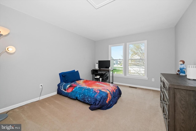 carpeted bedroom with visible vents and baseboards