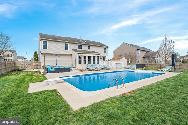 back of house with a yard, a fenced backyard, outdoor lounge area, and a patio