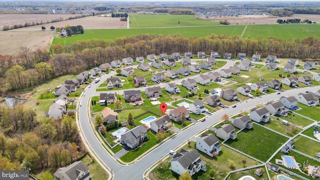 drone / aerial view with a residential view and a rural view