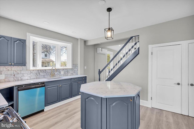 700 Pennsylvania Ave, Delanco, NJ 08075 - kitchen featuring a center island, a sink, decorative backsplash, light wood-style floors, and dishwashing machine