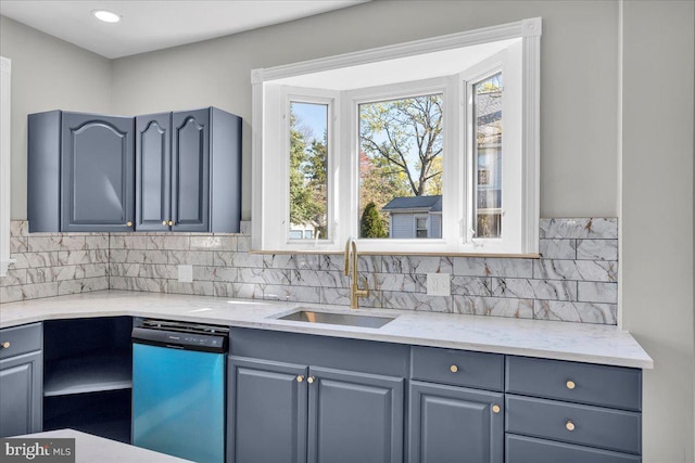 700 Pennsylvania Ave, Delanco, NJ 08075 - kitchen with light stone counters, dishwasher, gray cabinets, a sink, and decorative backsplash