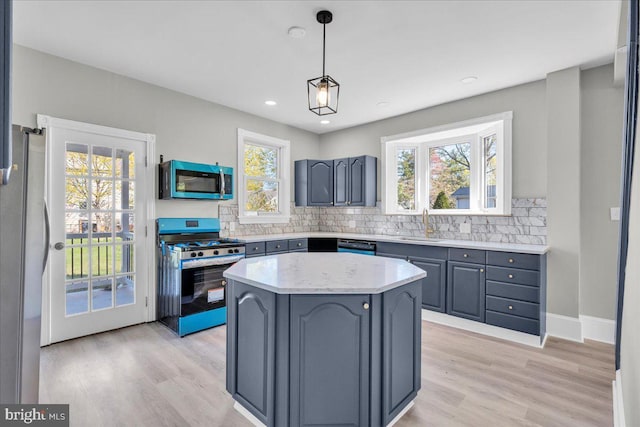 700 Pennsylvania Ave, Delanco, NJ 08075 - kitchen with light wood finished floors, gray cabinetry, backsplash, and appliances with stainless steel finishes