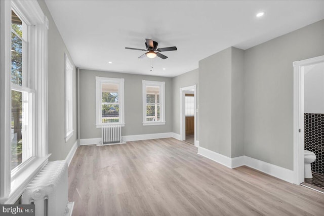 700 Pennsylvania Ave, Delanco, NJ 08075 - unfurnished living room with light wood finished floors, a ceiling fan, baseboards, and radiator