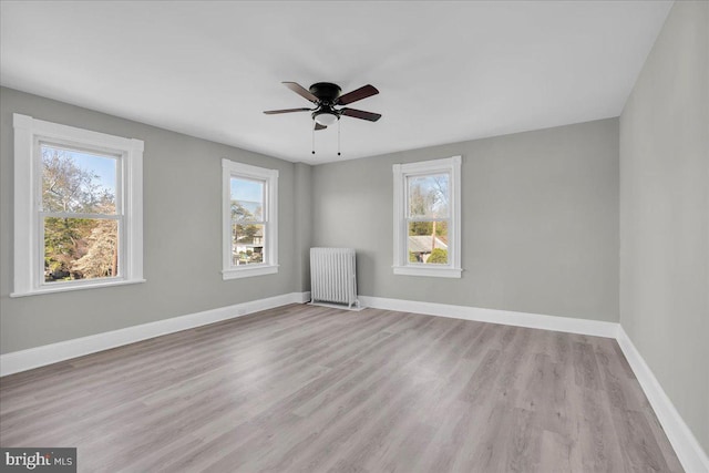 700 Pennsylvania Ave, Delanco, NJ 08075 - empty room with radiator heating unit, wood finished floors, baseboards, and ceiling fan