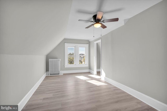 700 Pennsylvania Ave, Delanco, NJ 08075 - additional living space featuring a ceiling fan, wood finished floors, baseboards, radiator, and lofted ceiling