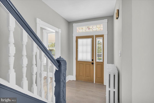 700 Pennsylvania Ave, Delanco, NJ 08075 - entryway with radiator, light wood-style flooring, baseboards, and stairs