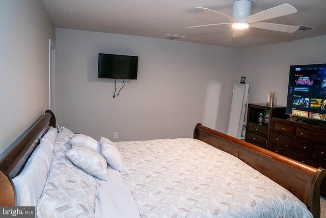 bedroom with visible vents and ceiling fan
