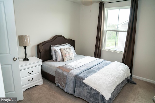 carpeted bedroom with baseboards
