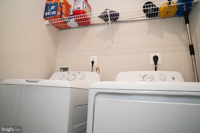 laundry room featuring independent washer and dryer and laundry area