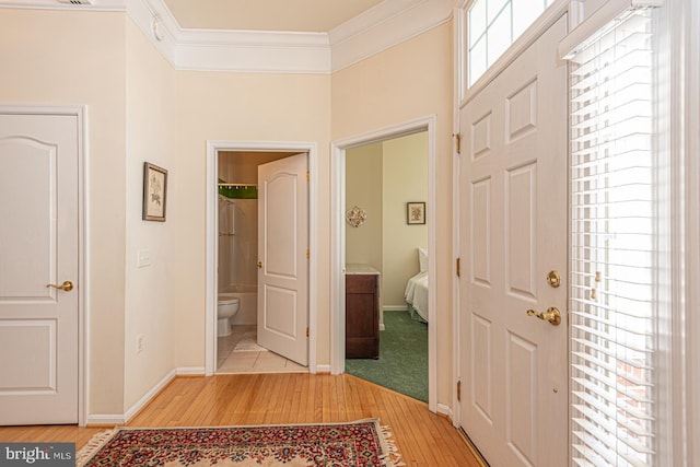 25 Easton Ave, Ocean Pines, MD 21811 - entrance foyer featuring light wood finished floors, baseboards, and crown molding