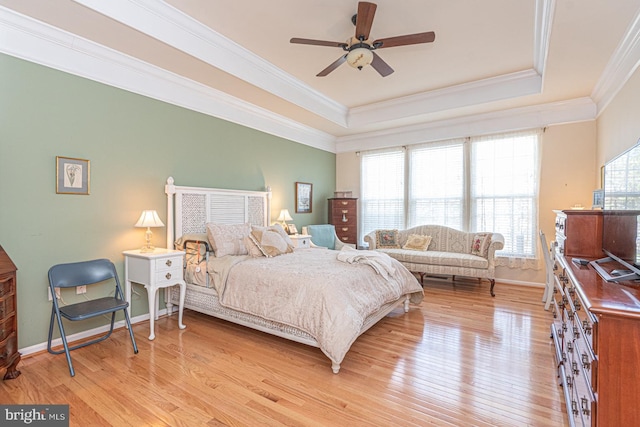 25 Easton Ave, Ocean Pines, MD 21811 - bedroom with crown molding, light wood-style flooring, a raised ceiling, and baseboards