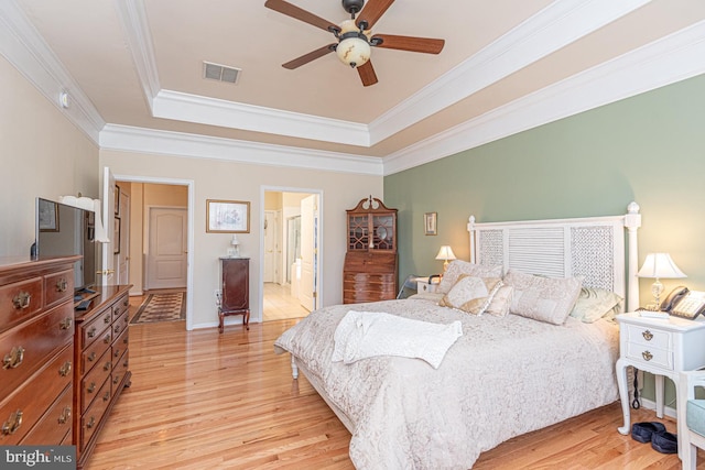 25 Easton Ave, Ocean Pines, MD 21811 - bedroom featuring ornamental molding, visible vents, light wood-style flooring, and a raised ceiling