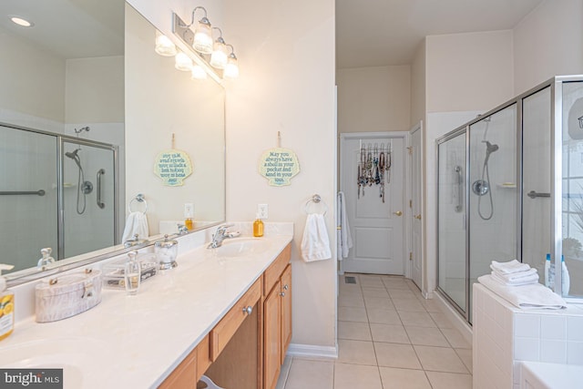 25 Easton Ave, Ocean Pines, MD 21811 - bathroom with a shower stall, tile patterned flooring, a sink, double vanity, and baseboards