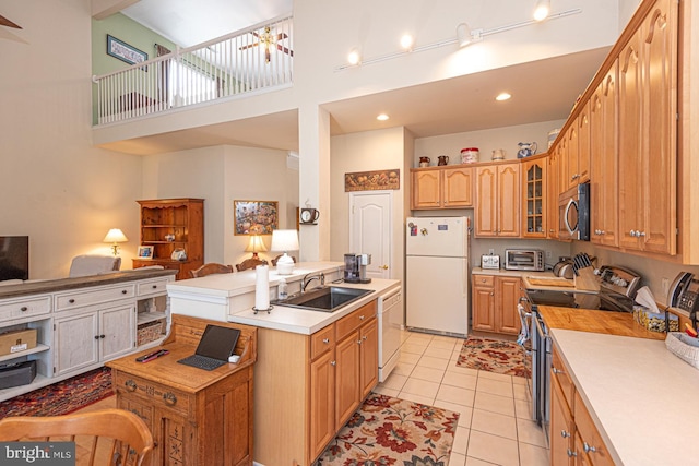 25 Easton Ave, Ocean Pines, MD 21811 - kitchen with open floor plan, glass insert cabinets, light countertops, appliances with stainless steel finishes, and a sink