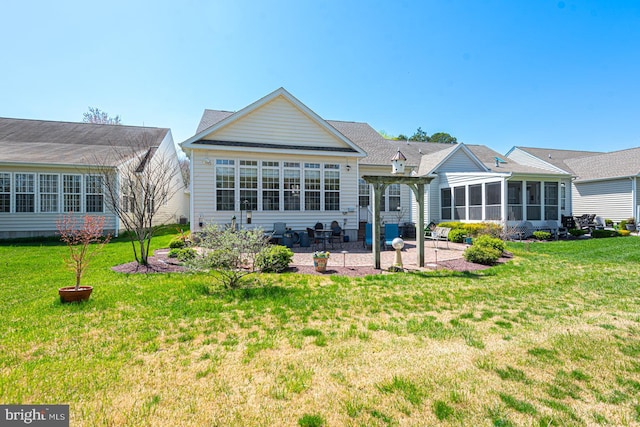 25 Easton Ave, Ocean Pines, MD 21811 - rear view of property with a sunroom, a patio, and a yard