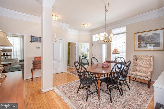 25 Easton Ave, Ocean Pines, MD 21811 - dining area with decorative columns, ornamental molding, a chandelier, light wood finished floors, and baseboards