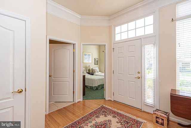 25 Easton Ave, Ocean Pines, MD 21811 - entrance foyer featuring light wood-style flooring, a healthy amount of sunlight, and ornamental molding