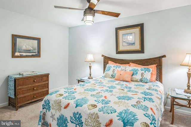bedroom with baseboards, a ceiling fan, and carpet floors