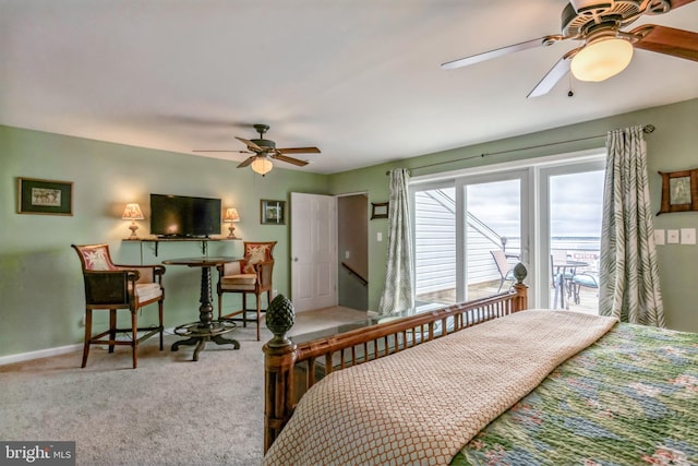 bedroom with access to exterior, baseboards, a ceiling fan, and carpet floors