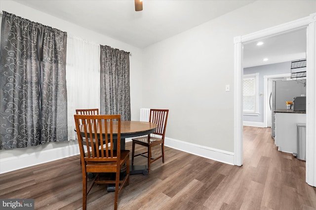 dining space with baseboards, recessed lighting, wood finished floors, and a ceiling fan