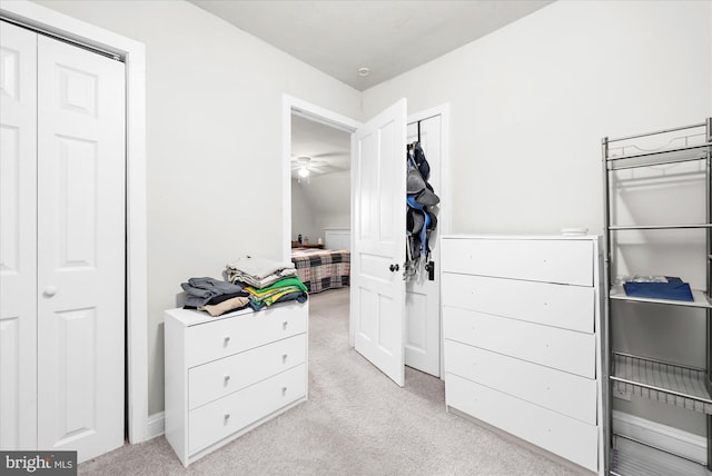 bedroom featuring light carpet