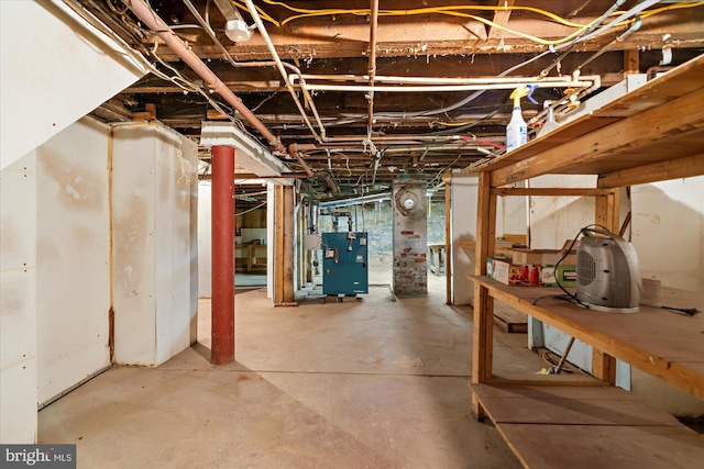 unfinished basement featuring a heating unit