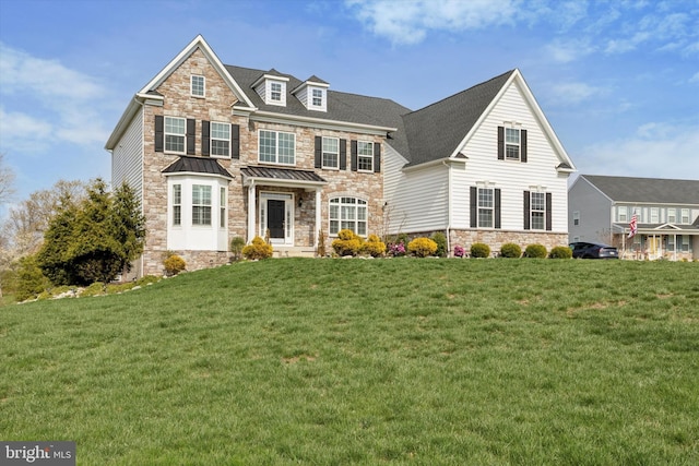 view of front of property featuring a front yard and stone siding