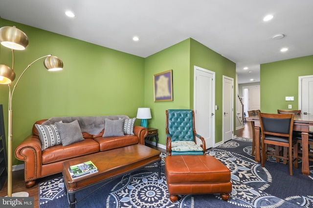 living area with recessed lighting and baseboards
