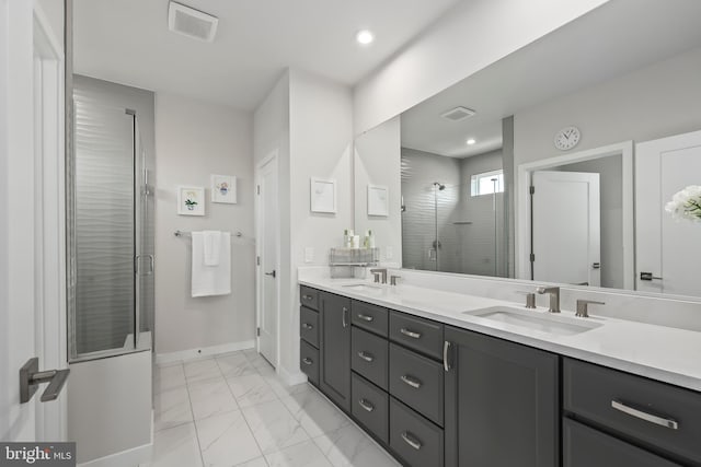 bathroom with visible vents, a shower stall, a sink, and marble finish floor
