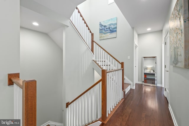 corridor with recessed lighting, baseboards, stairway, and hardwood / wood-style flooring