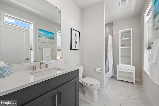 bathroom featuring visible vents, vanity, marble finish floor, toilet, and baseboards